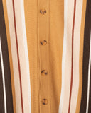 Close-up of the engineered jacquard stripes and tonal corozo buttons in camel