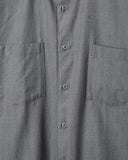 Close-up of the fabric on the Lok Kala Two-Pocket Shirt in dark grey