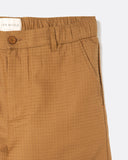 Close-up of the ripstop cloth and slanted front pocket on the Dekk Trouser in light brown