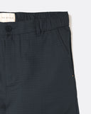 Close-up of the ripstop cloth and slanted front pocket on the Dekk Trouser in dark grey