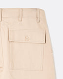 Close-up of the buttoned rear fatigue pocket on the Coup Trouser in tan