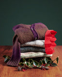 Stack of sweaters in Christmas studio set-up